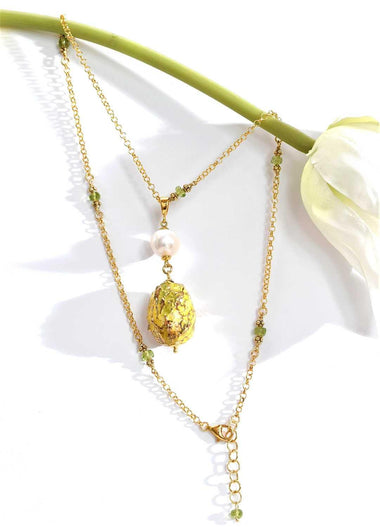 Collana con peridoto, perla e ceramica