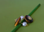 Gemelli con perla e occhio di tigre
