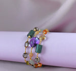 Bracciale multifilo con ametista, peridoto, quarzo citrino e cristallo di rocca dipinto con oro 24k
