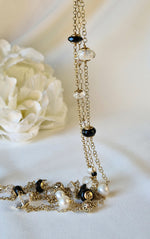 Collana lunga con perle, onice e cristallo di rocca