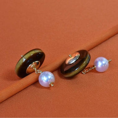 Gemelli con perla e occhio di tigre