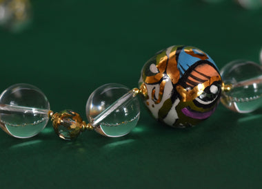 Collana donna con cristallo di rocca e ceramica dipinta a mano con oro 24k 